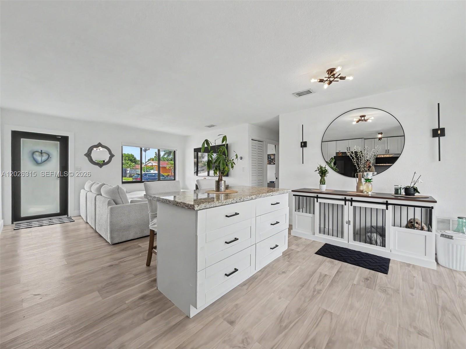 10762 Southwest 145th Street Miami, FL 33176 - Photo 21 of 28 a living room with furniture and wooden floor