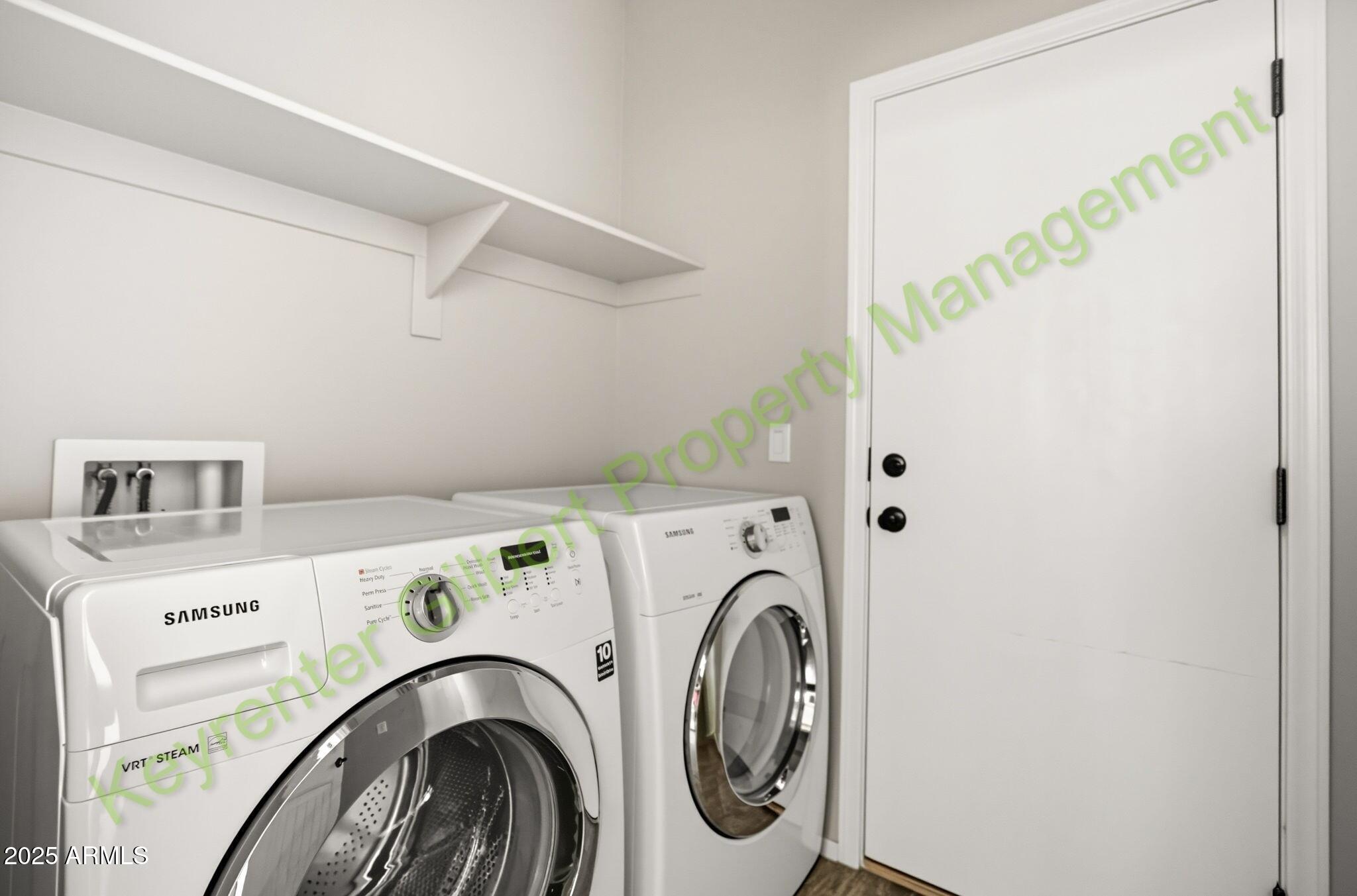4761 East Portola Valley Drive, Unit 102 Gilbert, AZ 85297 - Photo 13 of 34 a utility room with dryer and washer