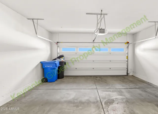 a kitchen with stainless steel appliances granite countertop a refrigerator a sink a stove and cabinets