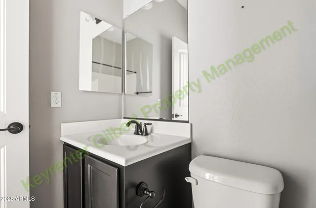 a kitchen with granite countertop a sink cabinets and window