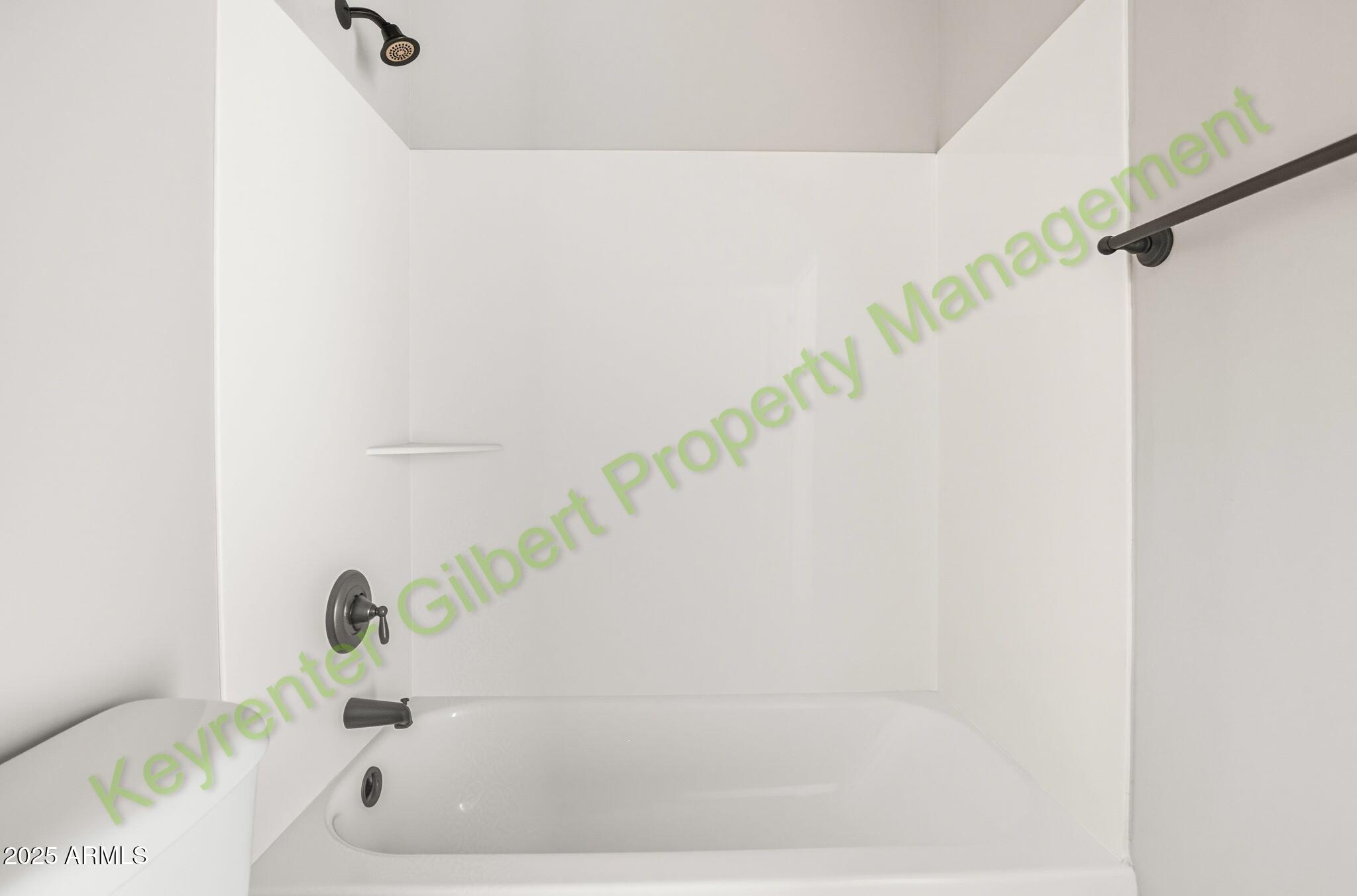 4761 East Portola Valley Drive, Unit 102 Gilbert, AZ 85297 - Photo 16 of 34 a bathroom with a bathtub