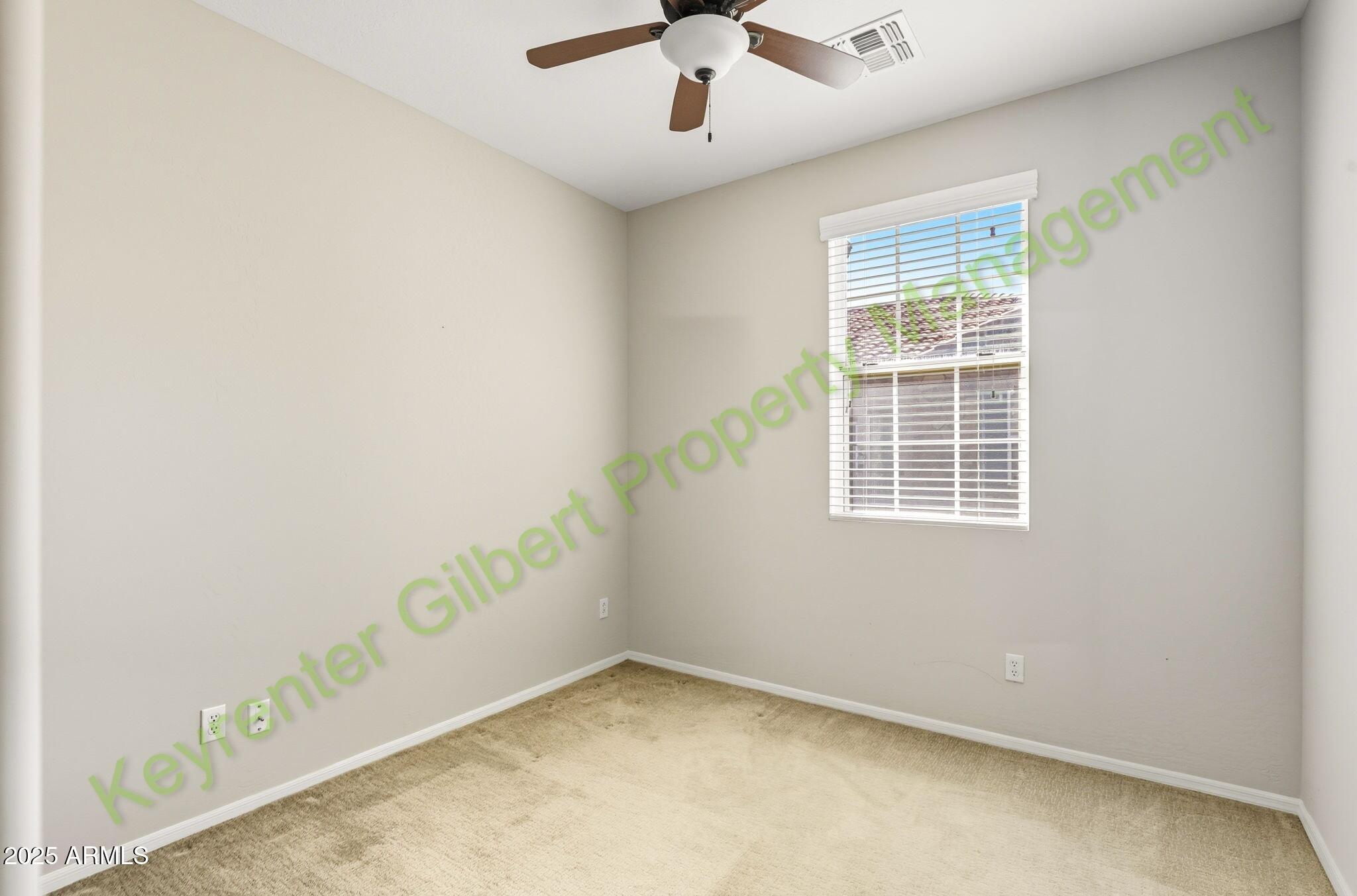 4761 East Portola Valley Drive, Unit 102 Gilbert, AZ 85297 - Photo 19 of 34 an empty room with windows
