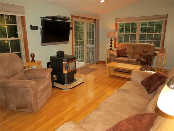 5 Houghton Road Sutton, MA 01590 - Photo 11 of 26 a living room with furniture and a flat screen tv