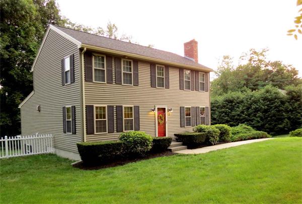 5 Houghton Road Sutton, MA 01590 - Photo 2 of 26 a front view of a house with a garden