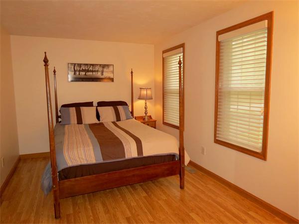 5 Houghton Road Sutton, MA 01590 - Photo 21 of 26 a bedroom with a bed and wooden floor