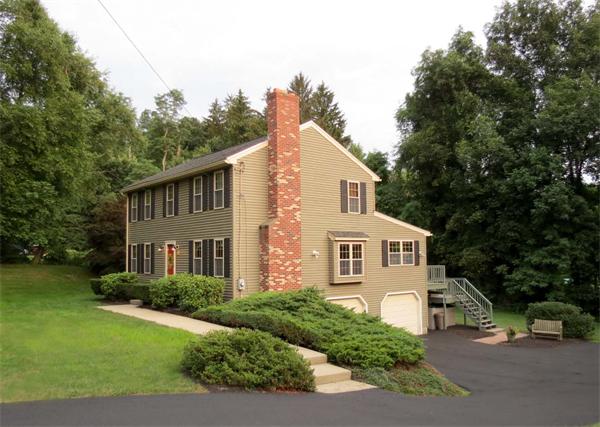 5 Houghton Road Sutton, MA 01590 - Photo 3 of 26 a front view of a house with a garden