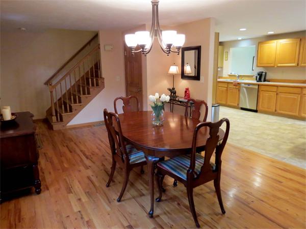 5 Houghton Road Sutton, MA 01590 - Photo 5 of 26 a view of a dining room with furniture and a chandelier