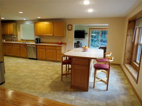 5 Houghton Road Sutton, MA 01590 - Photo 7 of 26 a kitchen with stainless steel appliances kitchen island granite countertop a sink and a stove