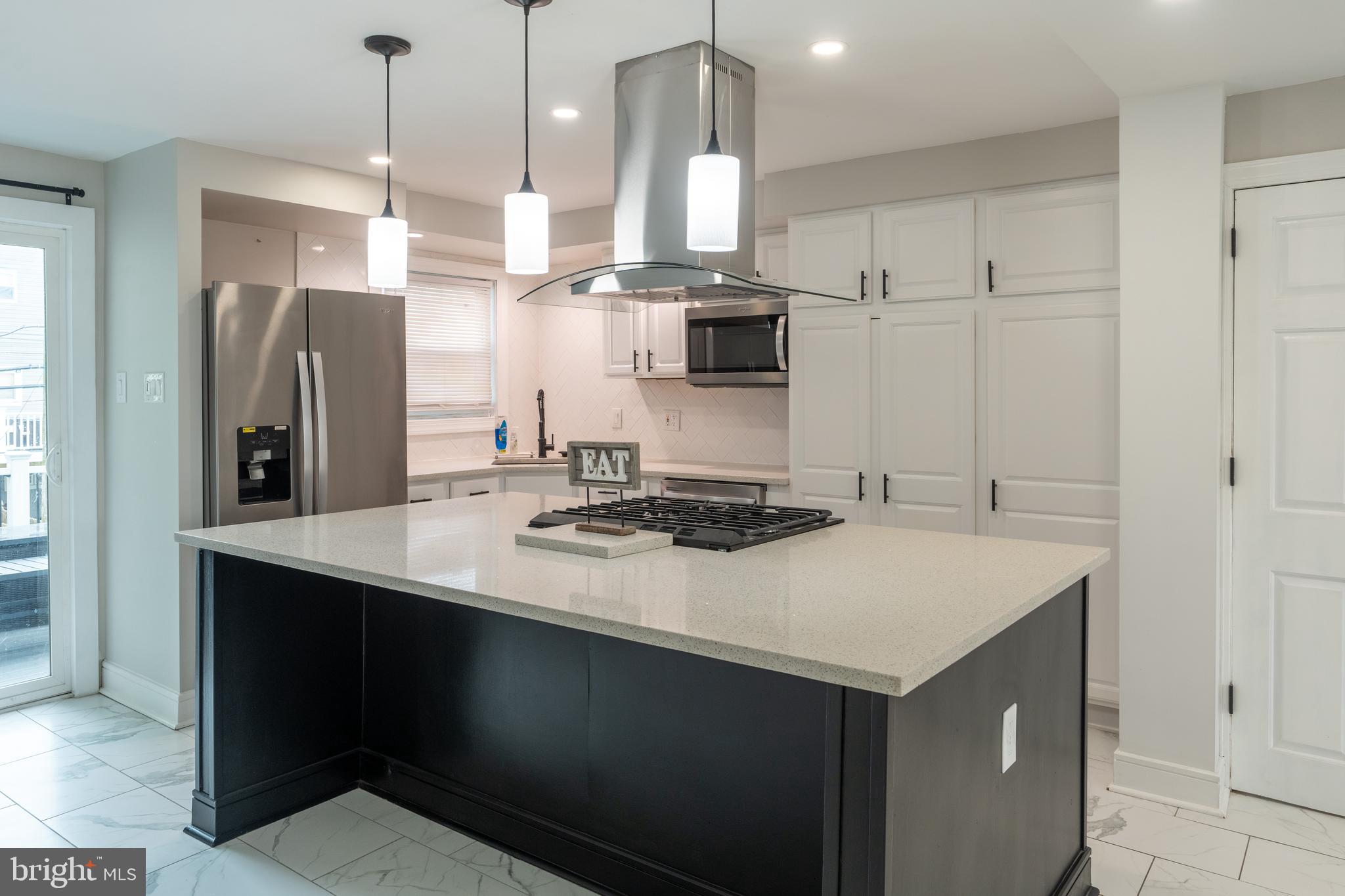 12675 Biscayne Drive Philadelphia, PA 19154 - Photo 11 of 50 a kitchen with stainless steel appliances a sink stove and refrigerator