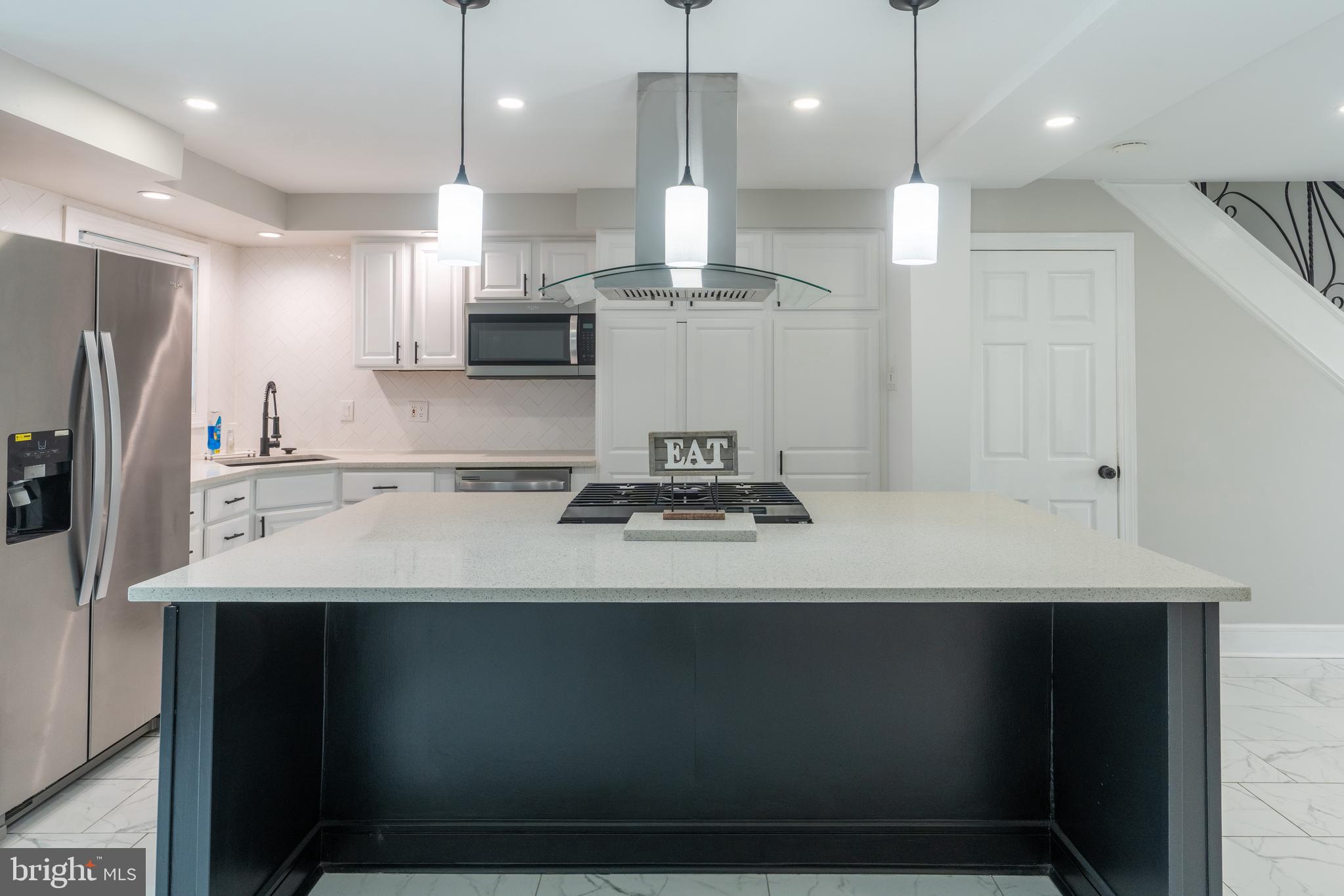 12675 Biscayne Drive Philadelphia, PA 19154 - Photo 12 of 50 a kitchen with kitchen island sink stove and refrigerator