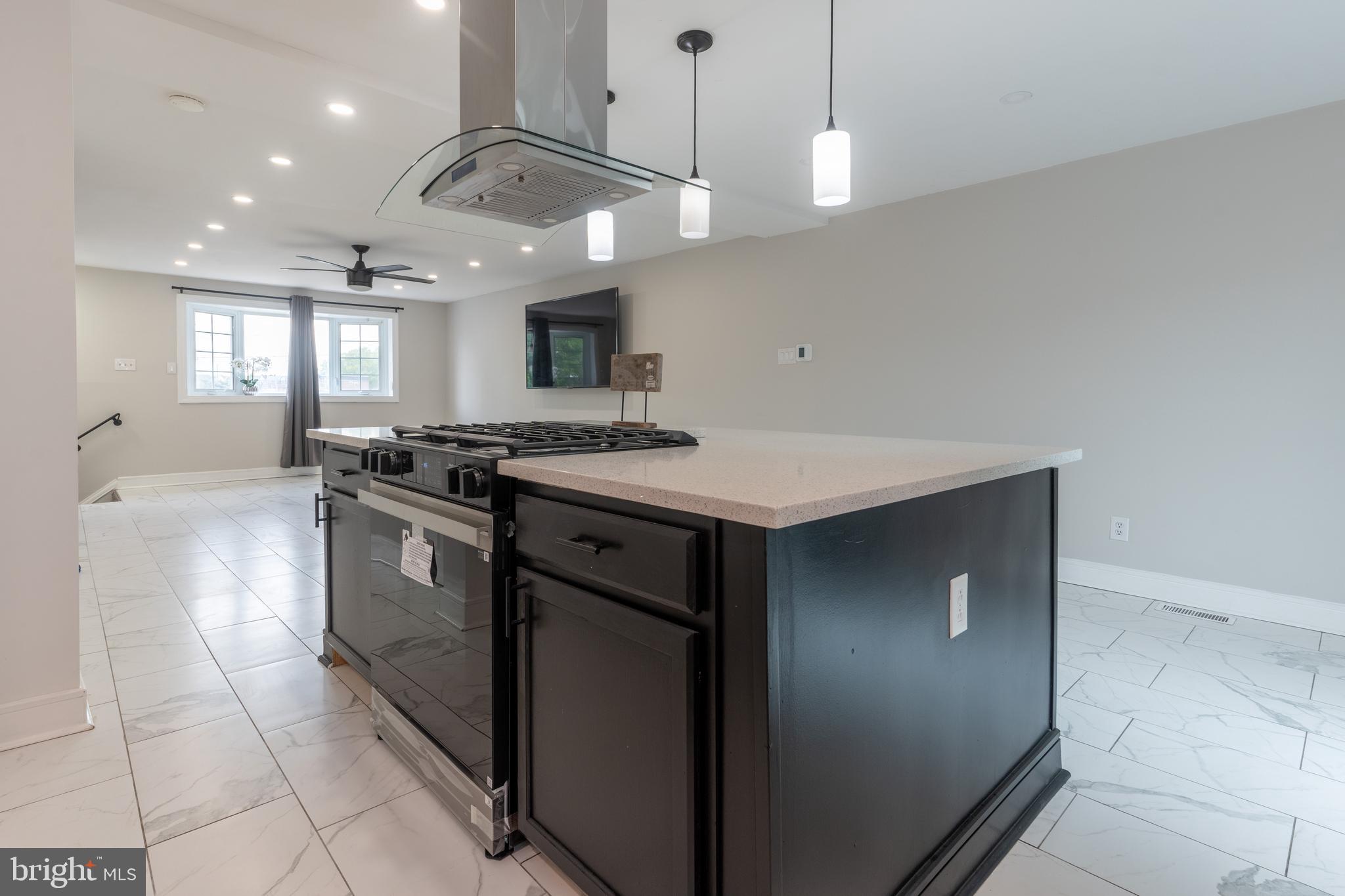 12675 Biscayne Drive Philadelphia, PA 19154 - Photo 14 of 50 a kitchen with a stove a refrigerator and a microwave