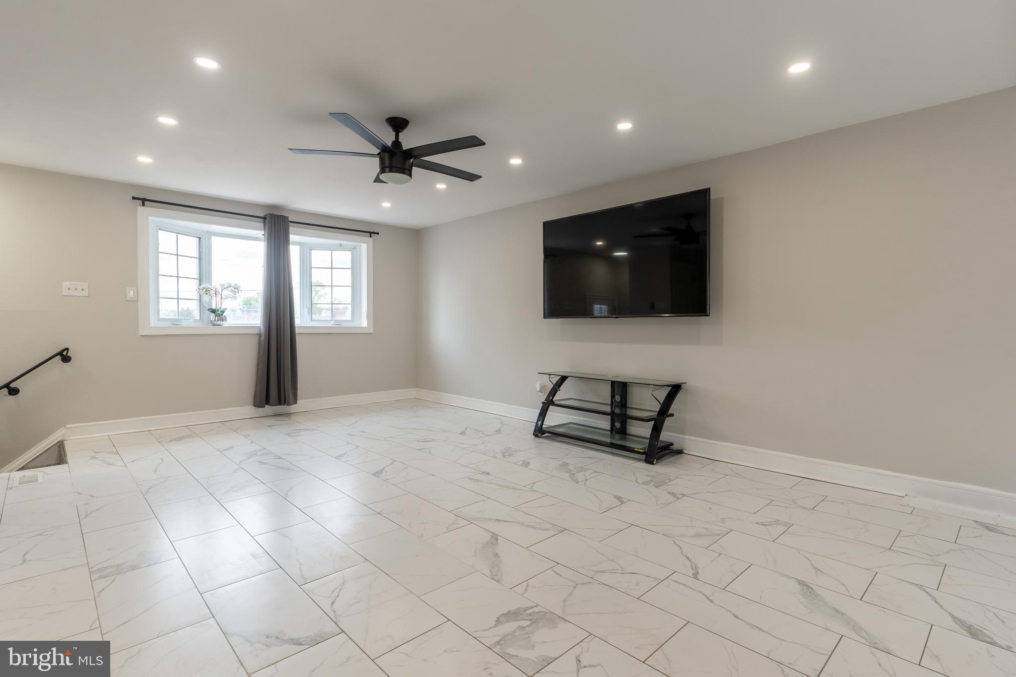 12675 Biscayne Drive Philadelphia, PA 19154 - Photo 22 of 50 a living room with furniture and a flat screen tv