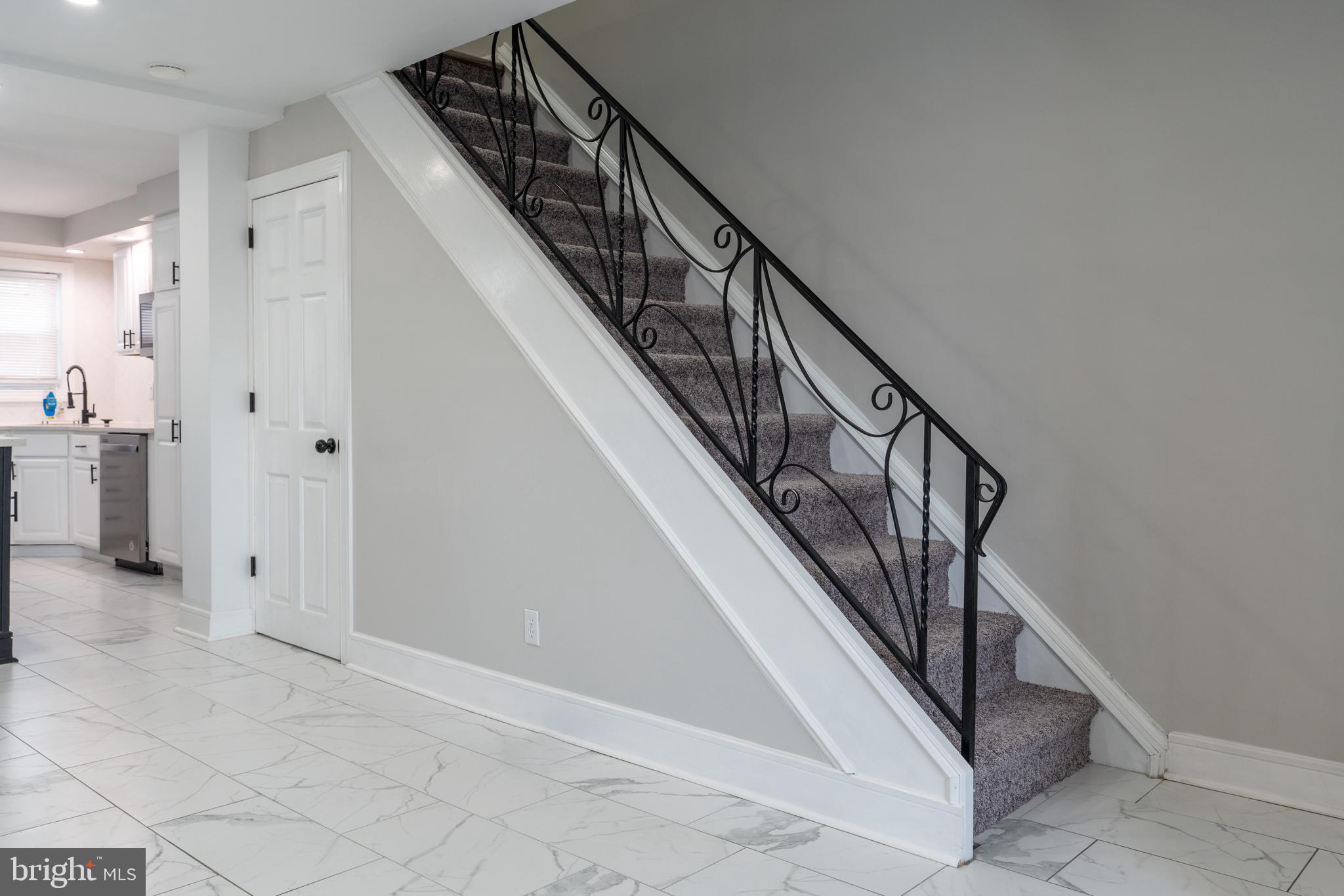 12675 Biscayne Drive Philadelphia, PA 19154 - Photo 31 of 50 a view of staircase with lots of frames on wall and wooden floor