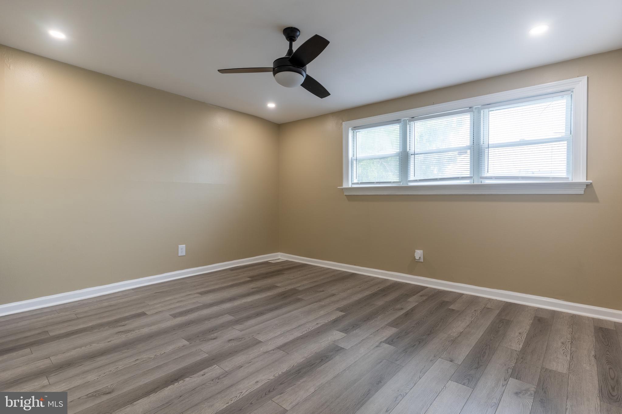 12675 Biscayne Drive Philadelphia, PA 19154 - Photo 33 of 50 an empty room with wooden floor and windows