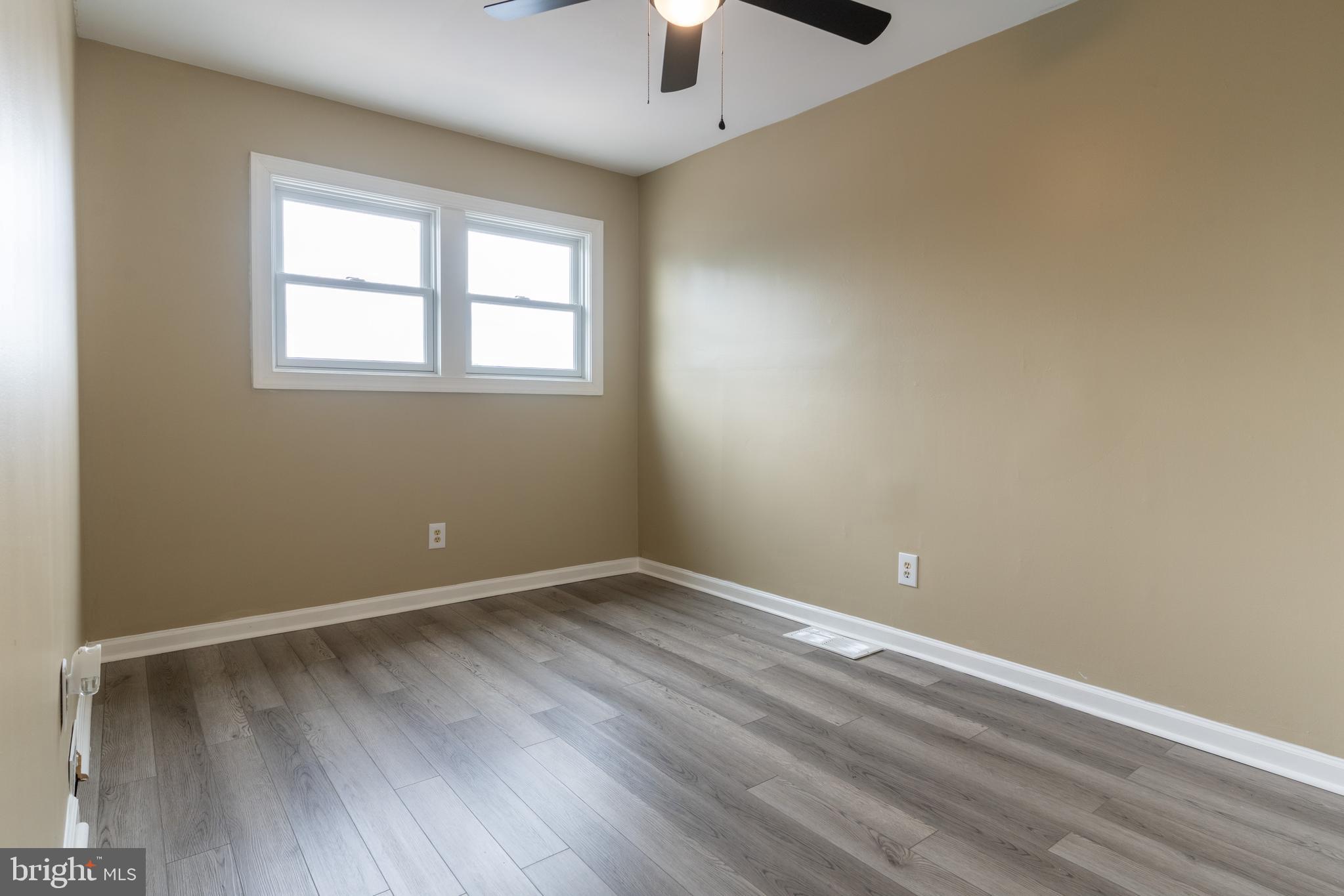 12675 Biscayne Drive Philadelphia, PA 19154 - Photo 40 of 50 wooden floor in an empty room with a window