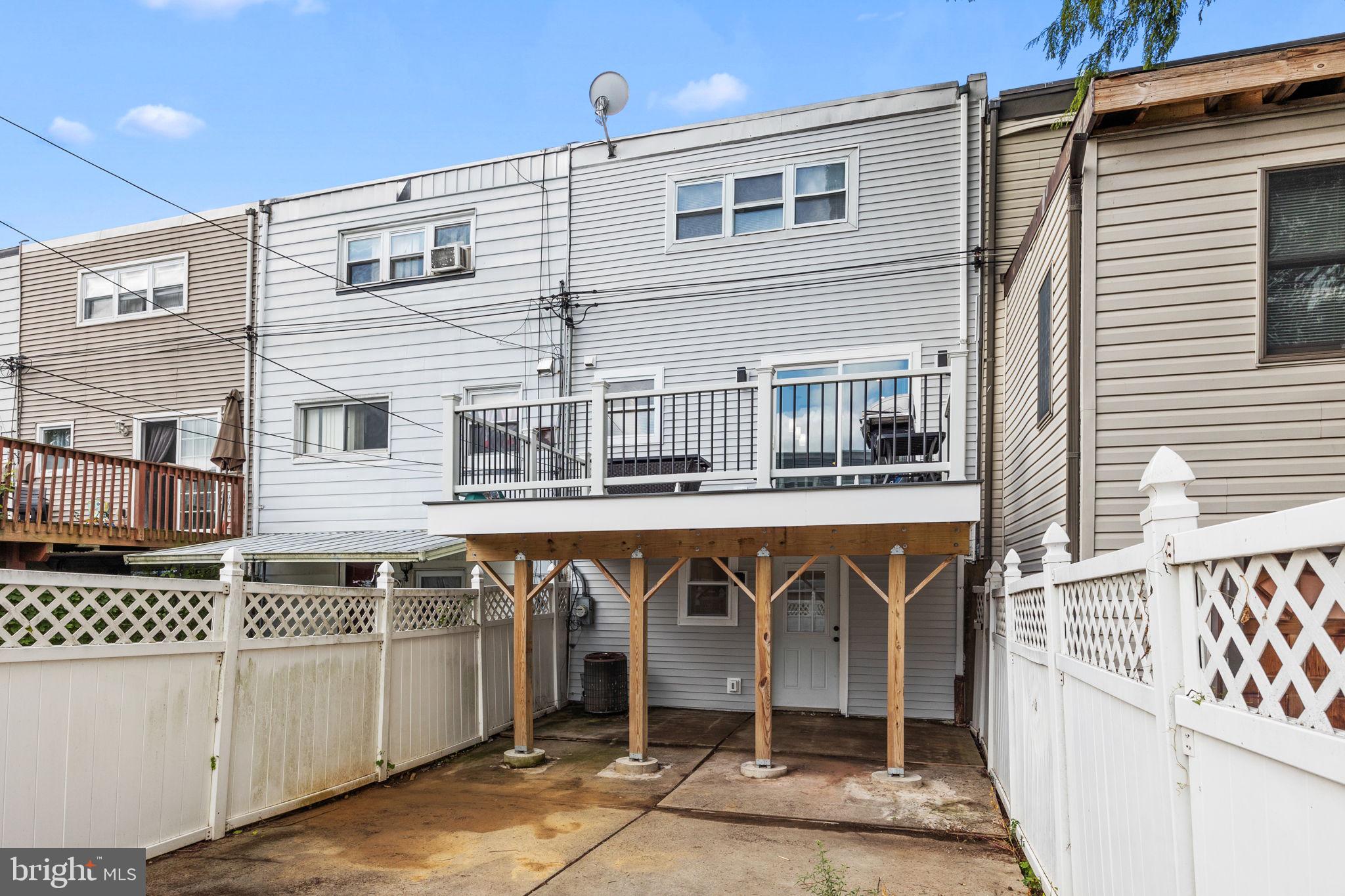 12675 Biscayne Drive Philadelphia, PA 19154 - Photo 4 of 50 a front view of a house with a balcony
