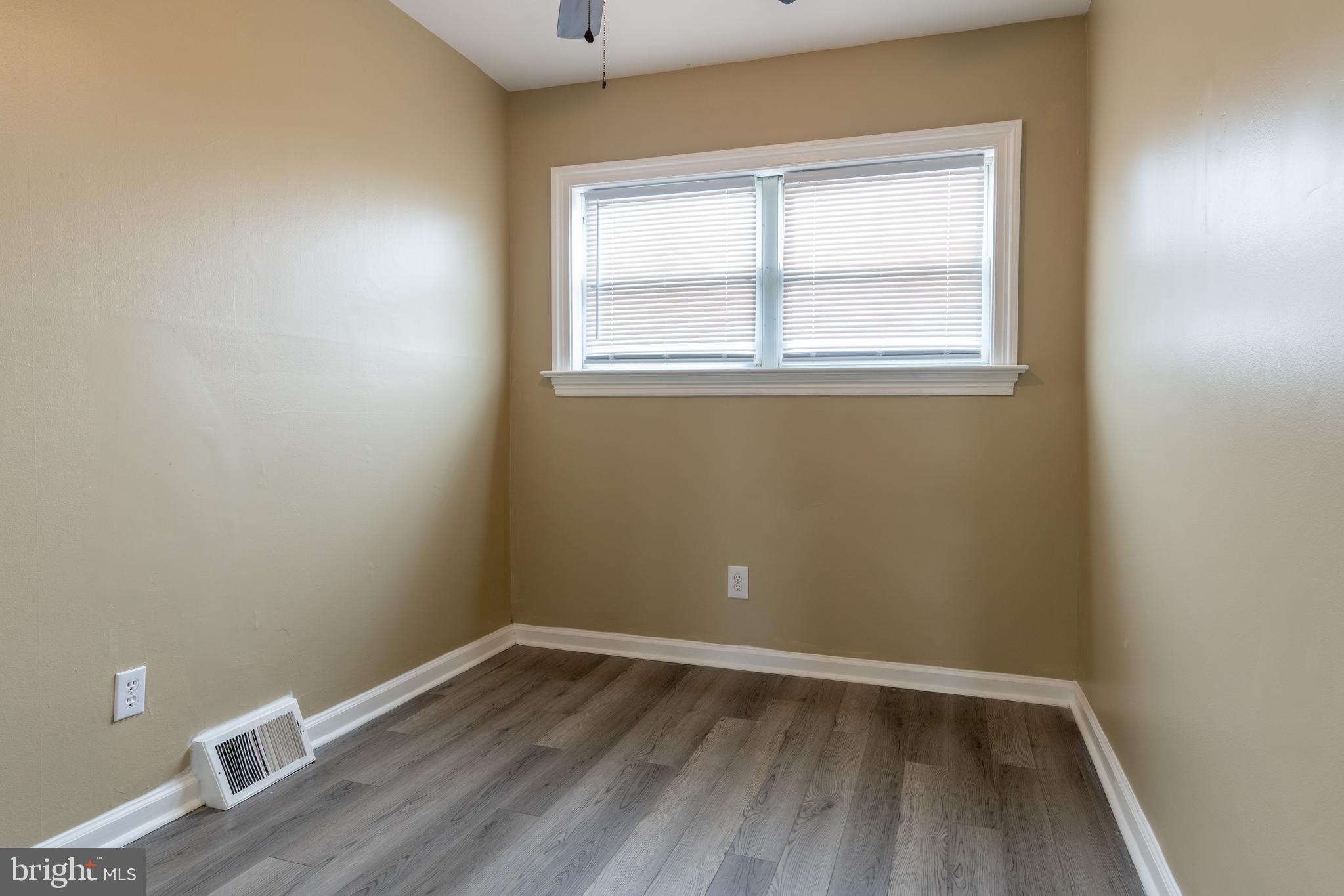 12675 Biscayne Drive Philadelphia, PA 19154 - Photo 41 of 50 a view of an empty room with wooden floor and a window
