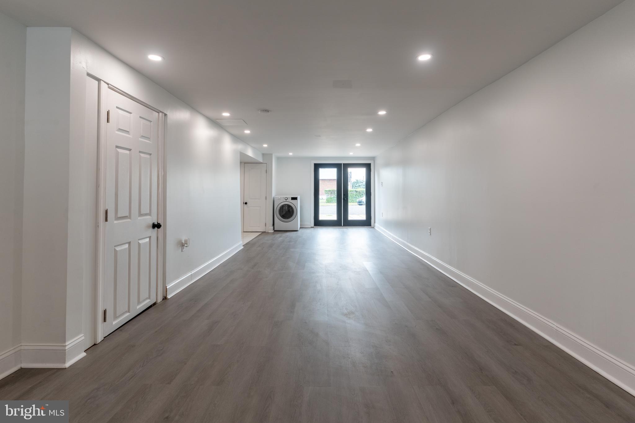 12675 Biscayne Drive Philadelphia, PA 19154 - Photo 46 of 50 an empty room with wooden floor and windows