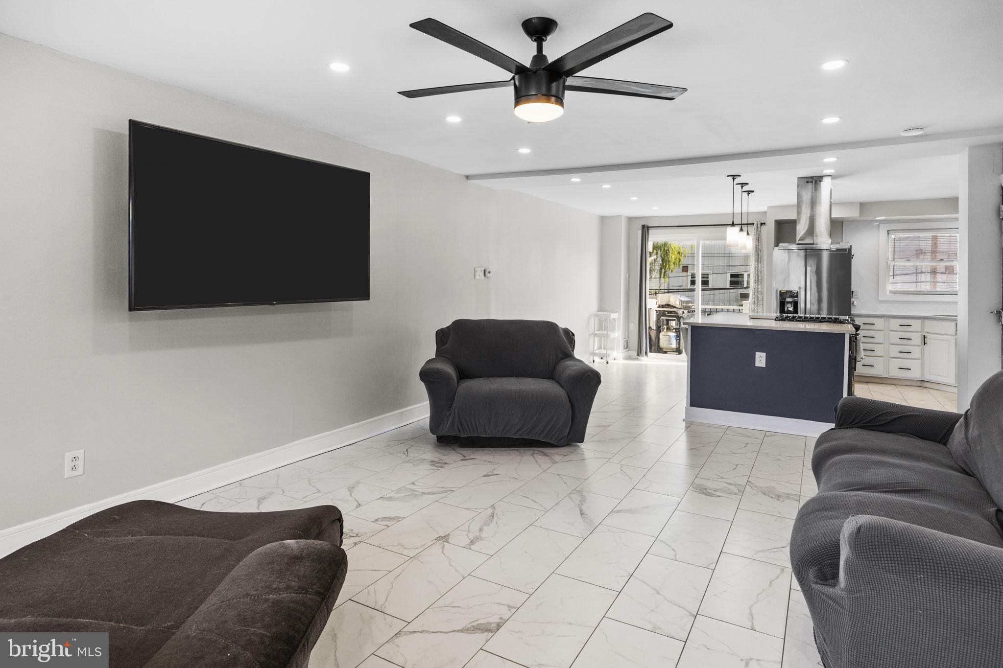 12675 Biscayne Drive Philadelphia, PA 19154 - Photo 8 of 50 a living room with furniture and a flat screen tv