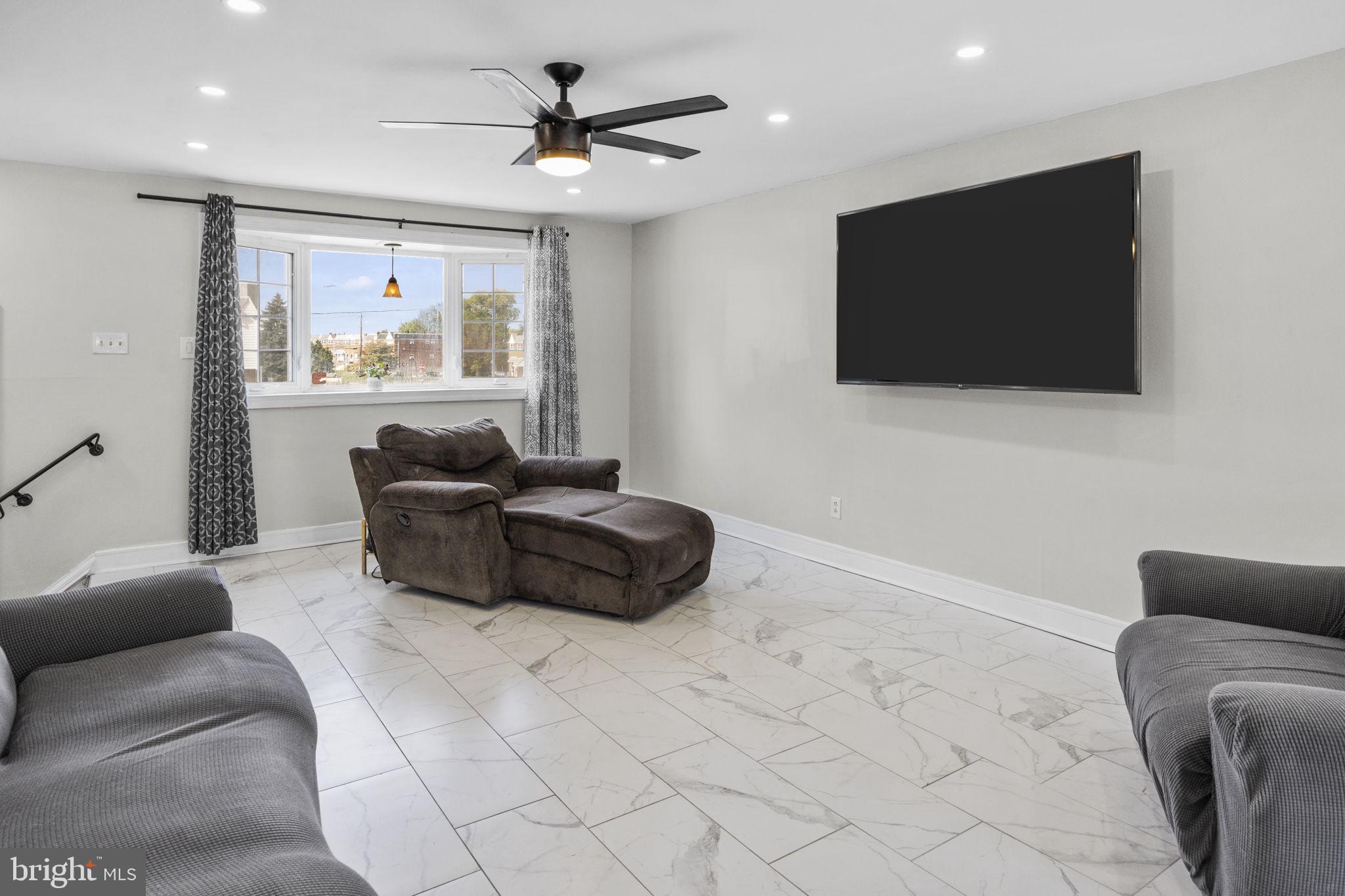 12675 Biscayne Drive Philadelphia, PA 19154 - Photo 10 of 50 a living room with furniture and a flat screen tv