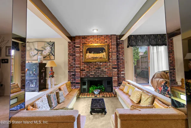 a dining room with furniture and chandelier kitchen view