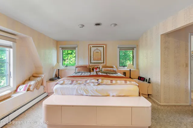 a bathroom with a granite countertop sink mirror and bathtub