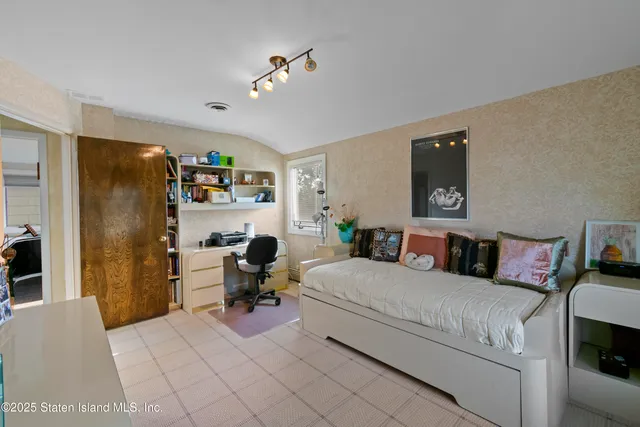 a bathroom with a granite countertop sink a toilet a mirror and bathtub