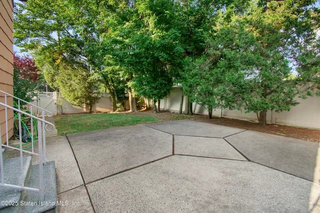 a view of backyard with a garden and plants