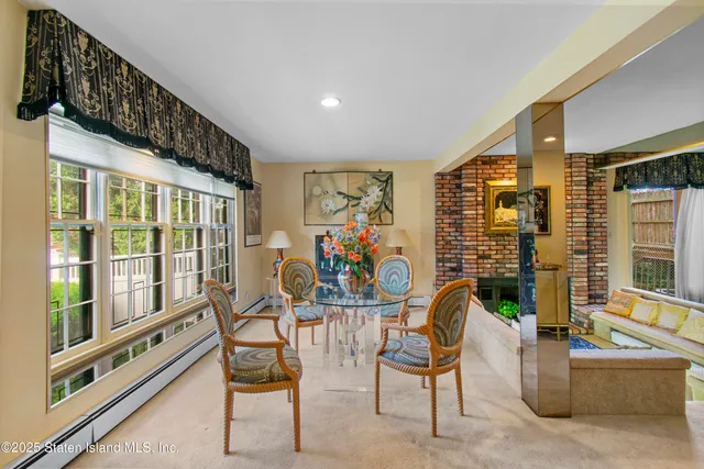 a view of a livingroom with furniture and windows