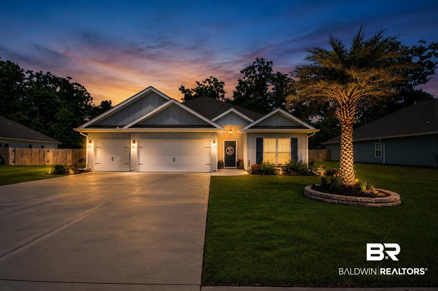 1885 Carly Street Foley, AL 36535 - Photo 1 of 40 Modern ranch-style home featuring a two-car garage, concrete driveway, and front lawn with a palm tree