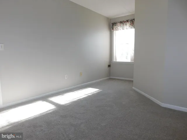 an empty room that has a window