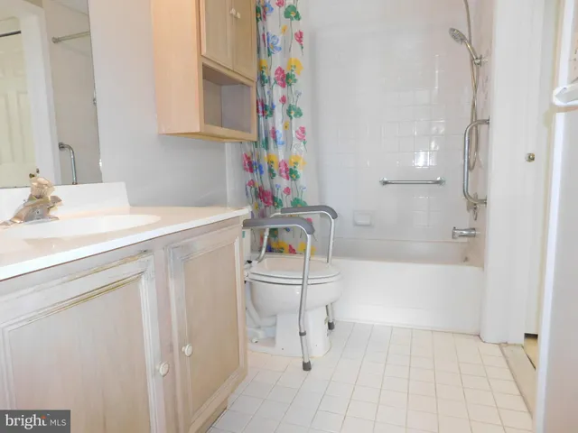 a bathroom with a sink a toilet and bathtub