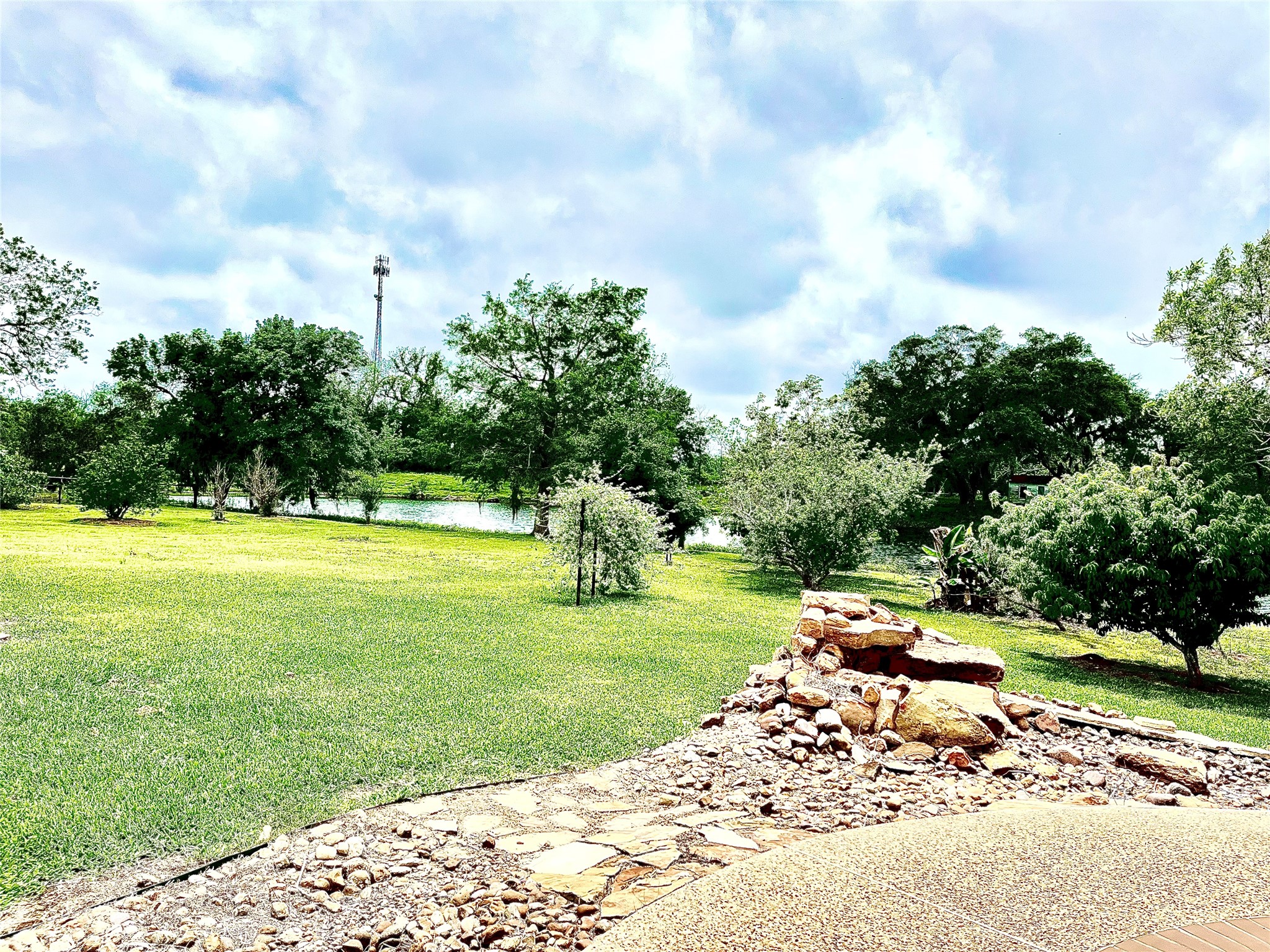 37243 FM 521 Road Bay City, TX 77414 - Photo 35 of 50 Horticulture crops such as citrus, peach trees, grapes and many others thrive in the soil. The pecan orchard immediately in front of home is grafted to excellent pecan variety “Forkert” which is a frequent winner of the Texas state pecan show. The pictured rock waterfall is the beginning of a unique water feature that meanders down to the lake using a recirculation pump in the lake!