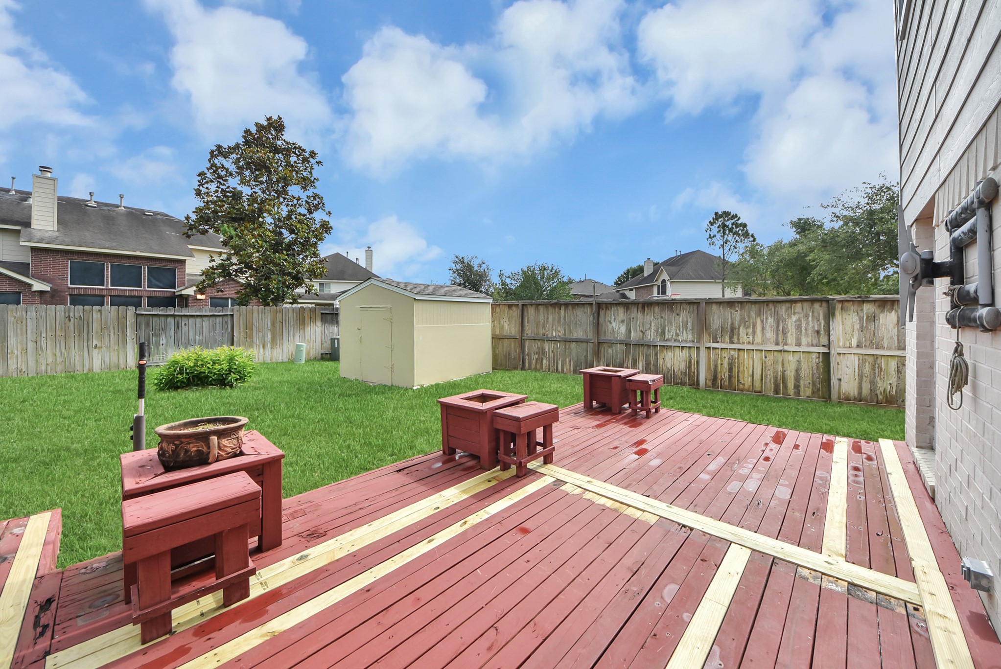 14103 Imperial Wood Lane Rosharon, TX 77583 - Photo 32 of 36 Backyard designed for relaxing and entertaining with oversized deck space and storage shed