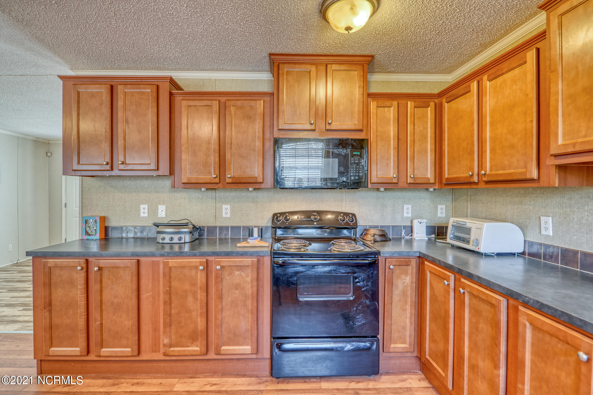 60 Gerainium Road Hampstead, NC 28443 - Photo 12 of 31 Kitchen Cabinets With Stove