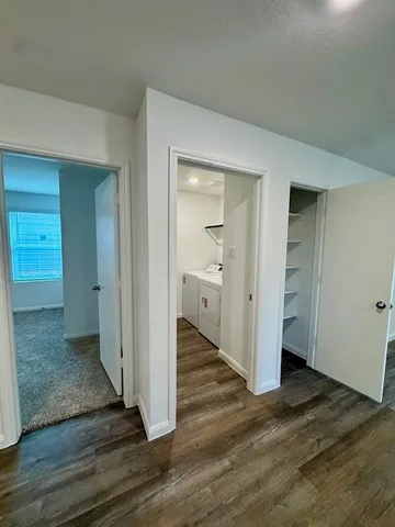 a view of storage and utility room with washer and dryer
