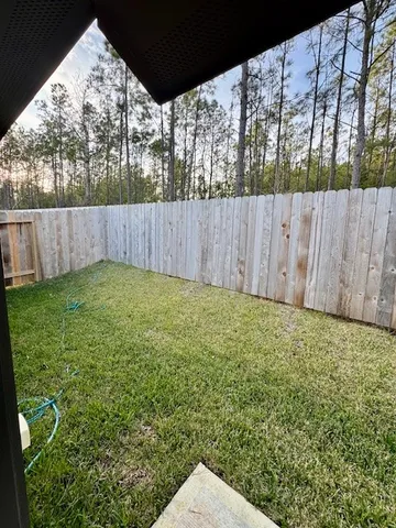 a backyard of a house with lots of green space