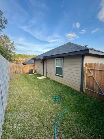 a kitchen with granite countertop a refrigerator oven a sink and dishwasher