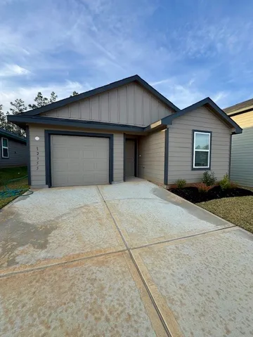 a view of a park with large trees