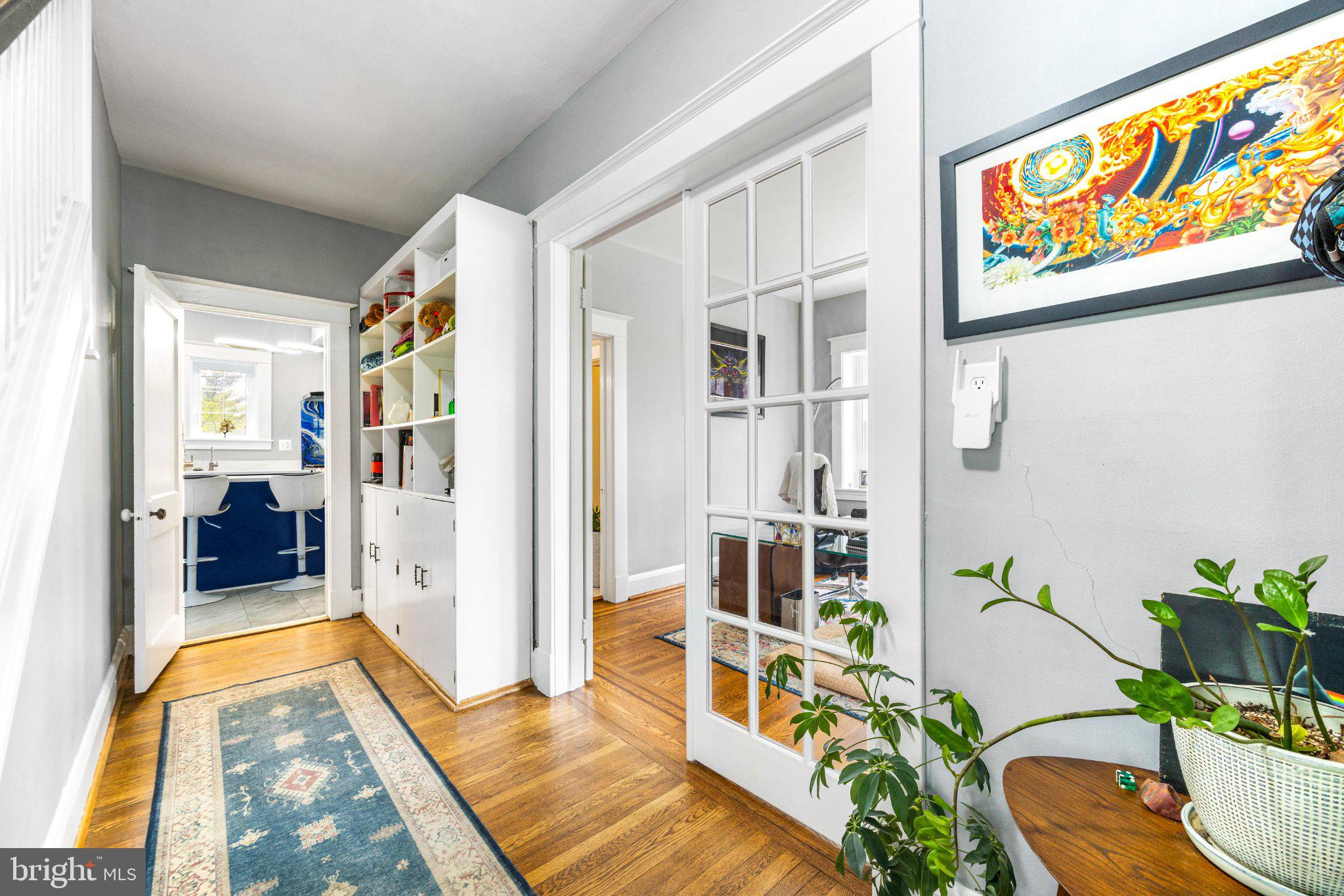 106 Edgewood Road Baltimore, MD 21286 - Photo 25 of 42 Charming hallway with vibrant art.
