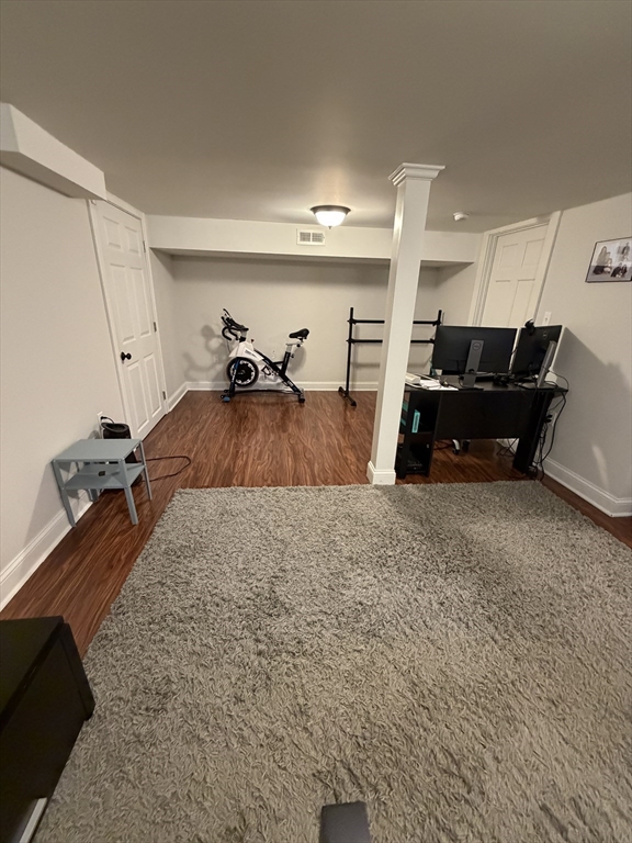 17 Cardinal Street, Unit 17 Winchester, MA 01890 - Photo 37 of 42 a living room with furniture and a flat screen tv