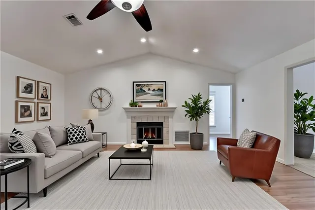 a living room with furniture and a fireplace