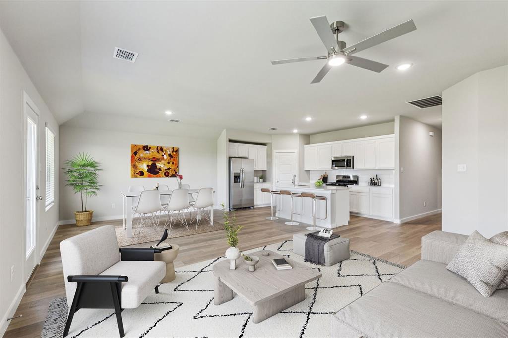 7804 Kingfisher Road Aubrey, TX 76227 - Photo 26 of 27 a living room with furniture and kitchen view