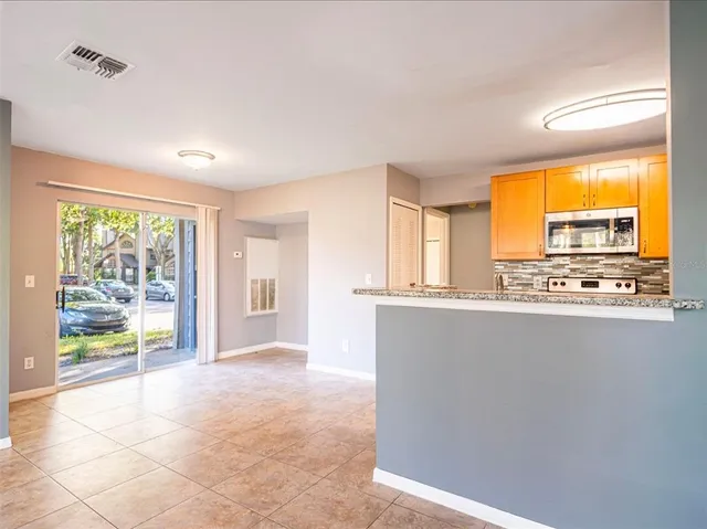 a view of an empty room with a window