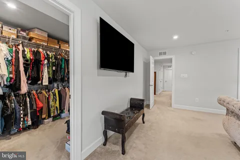 a view of a livingroom with furniture and a flat screen tv