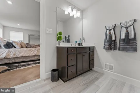 a bedroom with a bed and a dresser