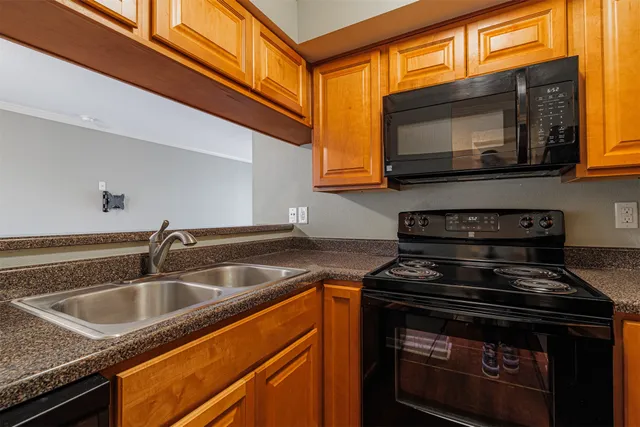 a kitchen with a stove and a microwave
