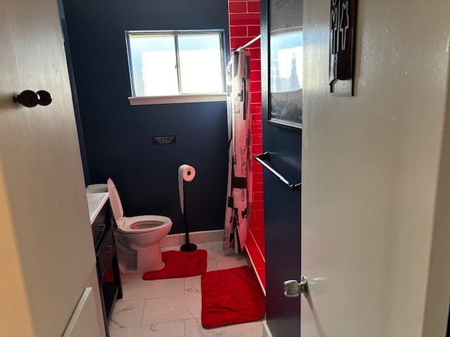 7003 Pyron Way Houston, TX 77036 - Photo 11 of 26 a bathroom with a toilet and a mirror