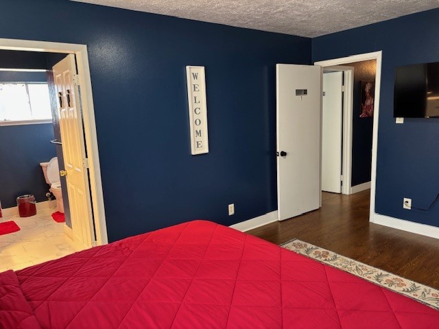 7003 Pyron Way Houston, TX 77036 - Photo 14 of 26 a bedroom with a bed and a dresser