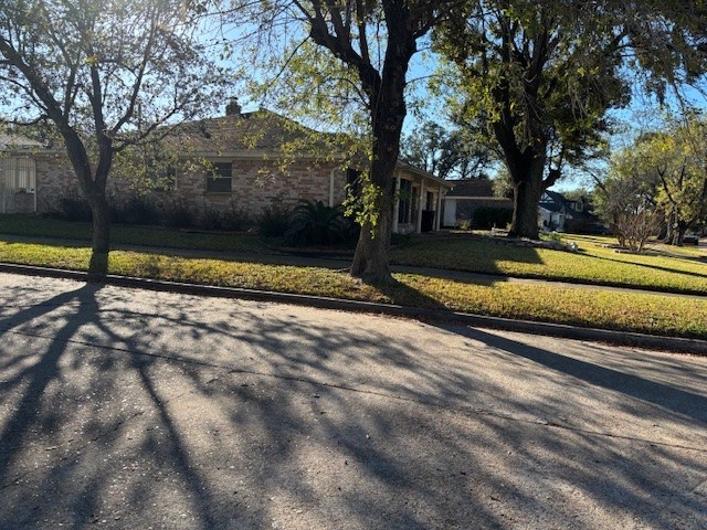 7003 Pyron Way Houston, TX 77036 - Photo 24 of 26 a view of a swimming pool with a yard
